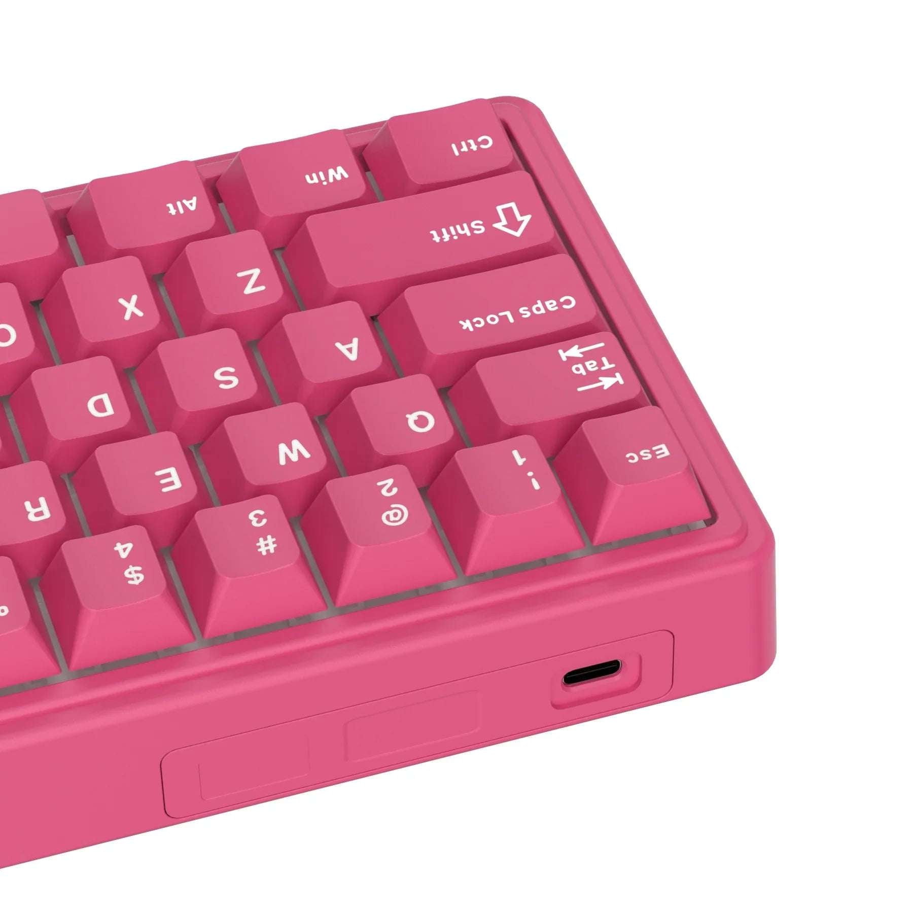 Compact mechanical keyboard with dark keycaps, beige highlights, and a metal volume knob