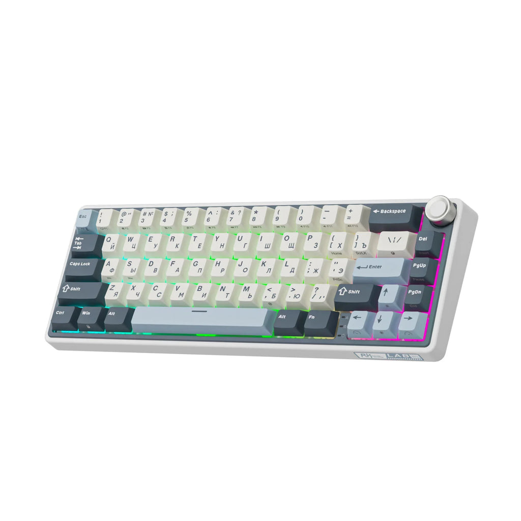 Compact mechanical keyboard with dark keycaps, beige highlights, and a metal volume knob