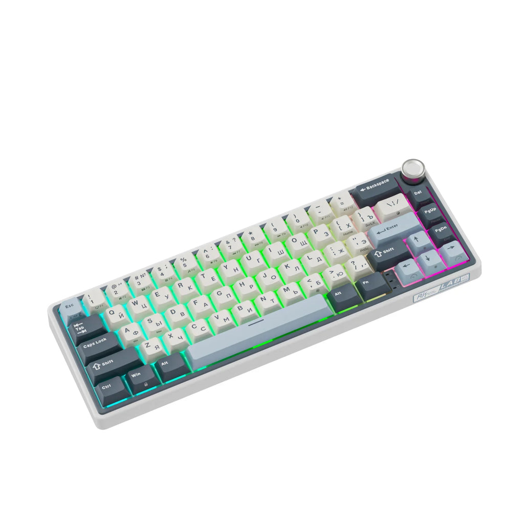 Compact mechanical keyboard with dark keycaps, beige highlights, and a metal volume knob