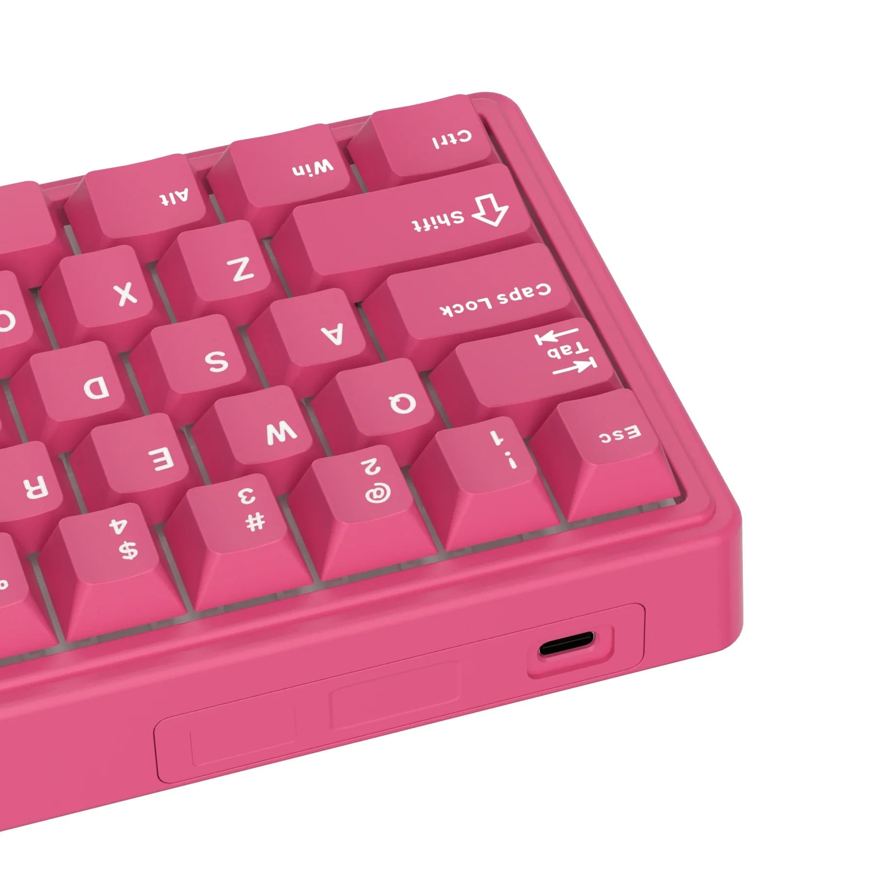 Compact mechanical keyboard with dark keycaps, beige highlights, and a metal volume knob
