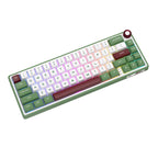 Compact mechanical keyboard with dark keycaps, beige highlights, and a metal volume knob