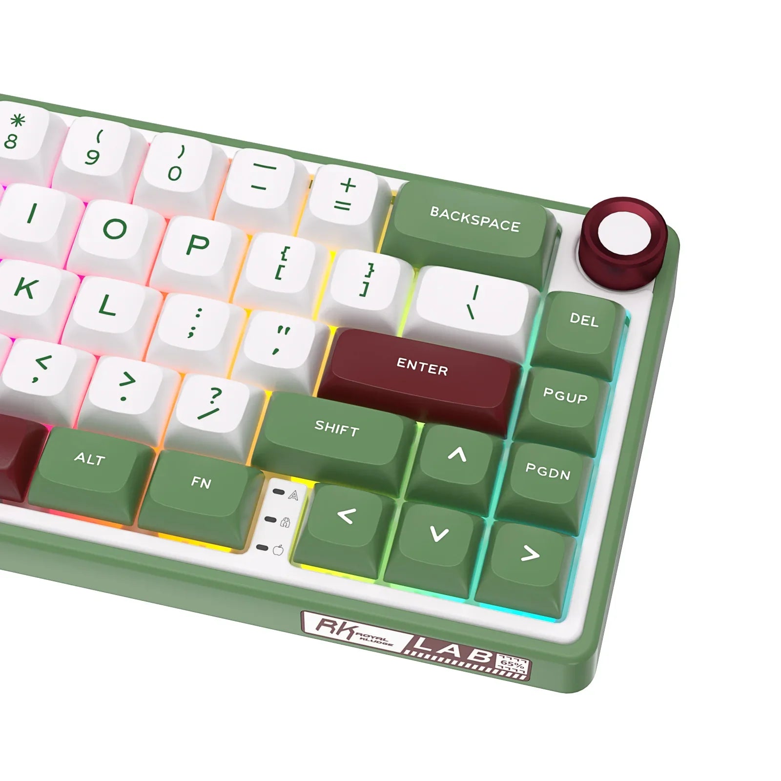 Compact mechanical keyboard with dark keycaps, beige highlights, and a metal volume knob